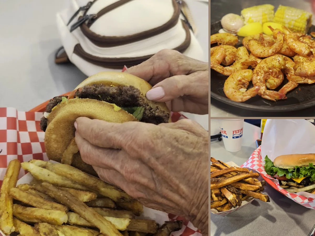 Burgers and fries on a casual restaurant table.